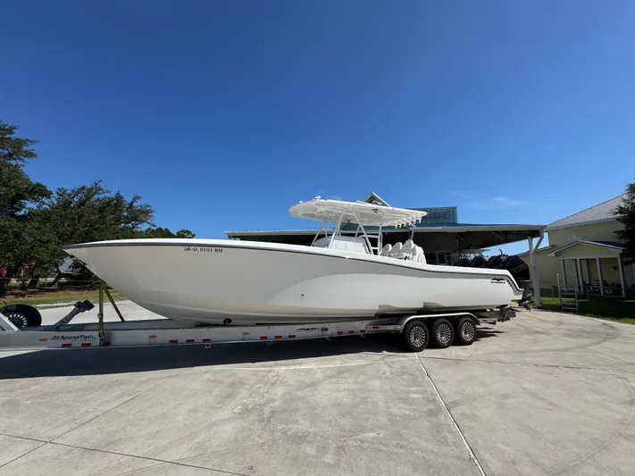  Yacht Photos Pics 2020 Invincible 39 Open Fisherman boat on trailer under clear blue sky.