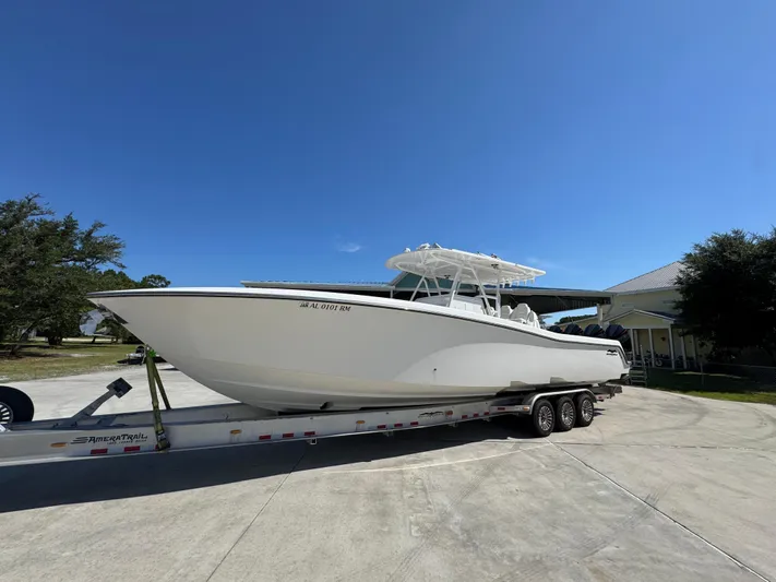  Yacht Photos Pics 2020 Invincible 39 Open Fisherman boat on trailer under clear blue sky.