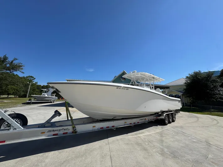  Yacht Photos Pics 2020 Invincible 39 Open Fisherman boat on trailer under clear blue sky.