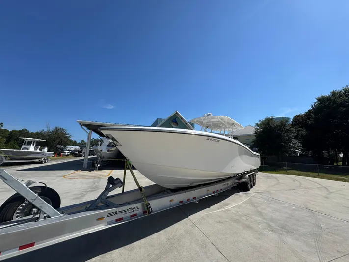  Yacht Photos Pics 2020 Invincible 39 Open Fisherman boat on trailer under clear blue sky.