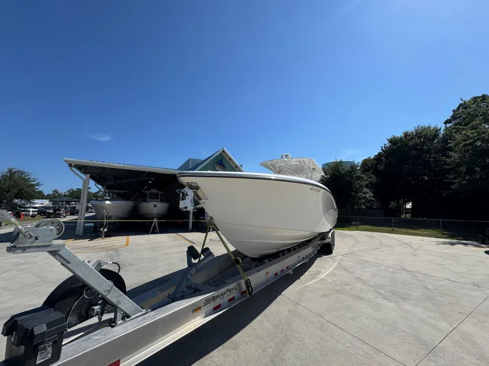  Yacht Photos Pics 2020 Invincible 39 Open Fisherman boat on trailer under clear blue sky.