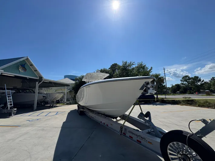  Yacht Photos Pics 2020 Invincible 39 Open Fisherman boat on trailer under clear blue sky.