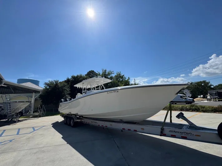  Yacht Photos Pics 2020 Invincible 39 Open Fisherman boat on trailer under sunny sky.