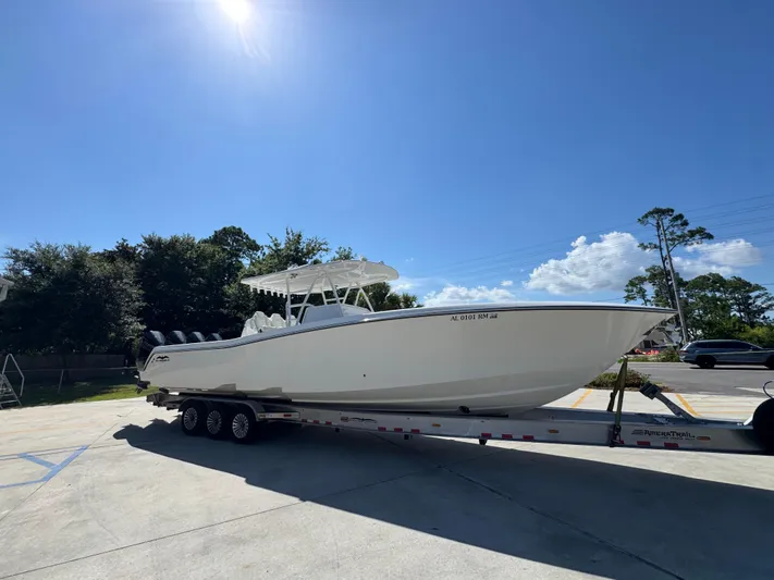  Yacht Photos Pics 2020 Invincible 39 Open Fisherman boat on trailer under clear blue sky.