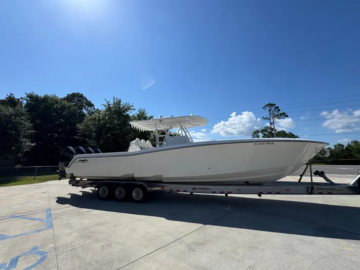  Yacht Photos Pics 2020 Invincible 39 Open Fisherman boat on trailer under clear blue sky.