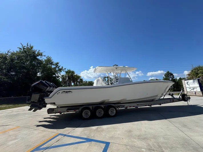  Yacht Photos Pics 2020 Invincible 39 Open Fisherman boat on trailer under clear blue sky.