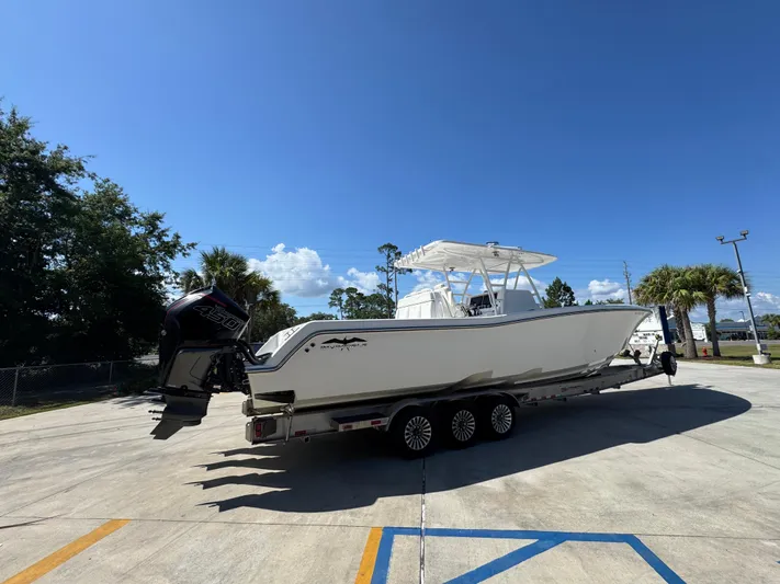  Yacht Photos Pics 2020 Invincible 39 Open Fisherman boat on trailer under clear blue sky.