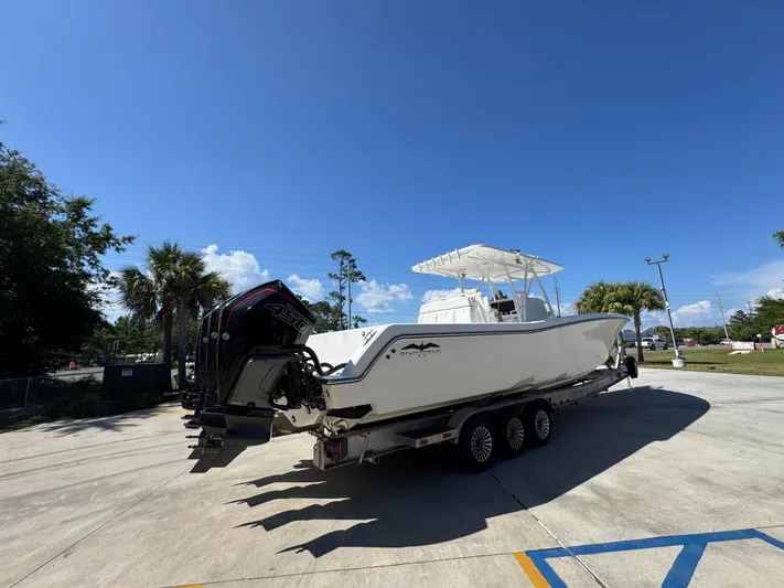  Yacht Photos Pics 2020 Invincible 39 Open Fisherman boat on trailer under clear blue sky.