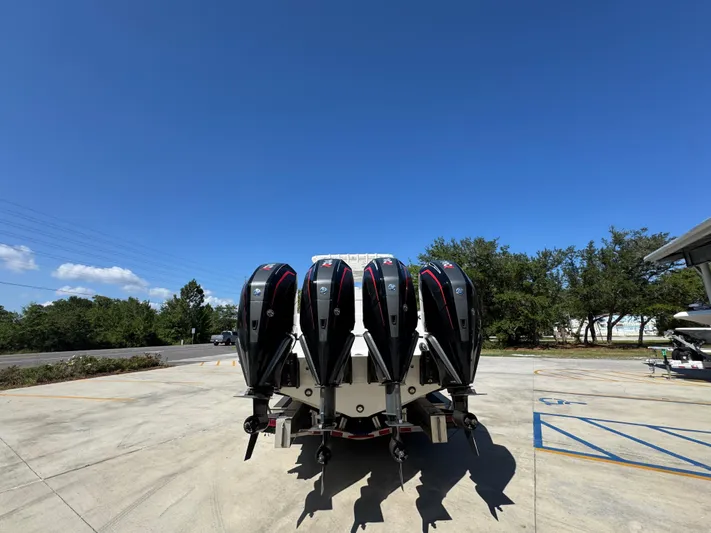  Yacht Photos Pics 2020 Invincible 39 Open Fisherman with four powerful outboard engines, parked outdoors.