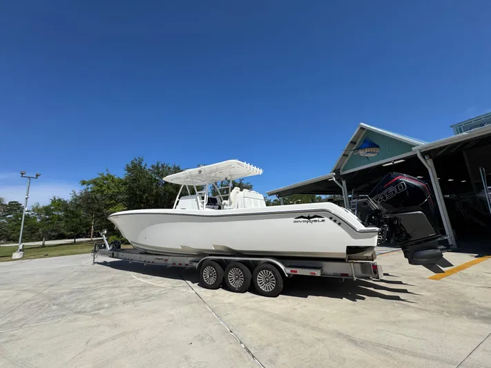 Yacht Photos Pics 2020 Invincible 39 Open Fisherman boat on trailer under clear blue sky.
