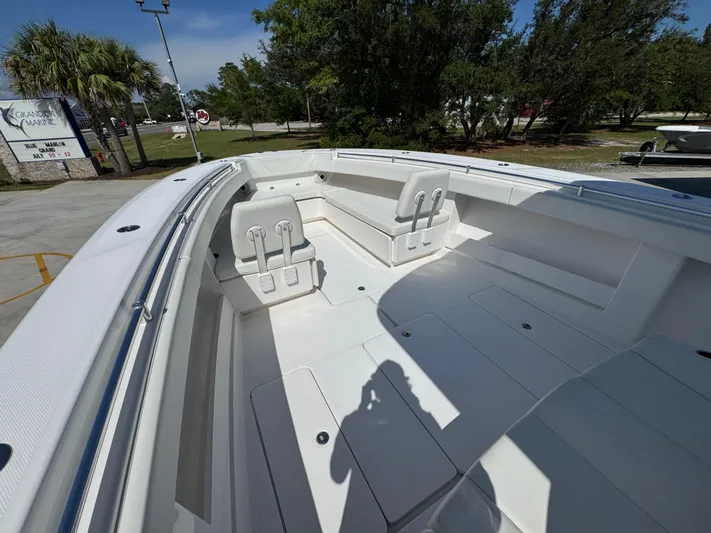  Yacht Photos Pics 2020 Invincible 39 Open Fisherman boat interior with seating and storage compartments.