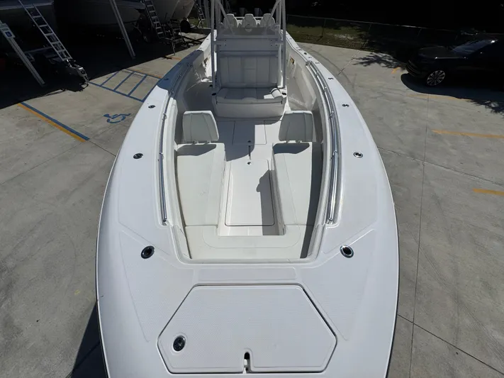  Yacht Photos Pics 2020 Invincible 39 Open Fisherman boat, spacious deck view, parked on concrete.