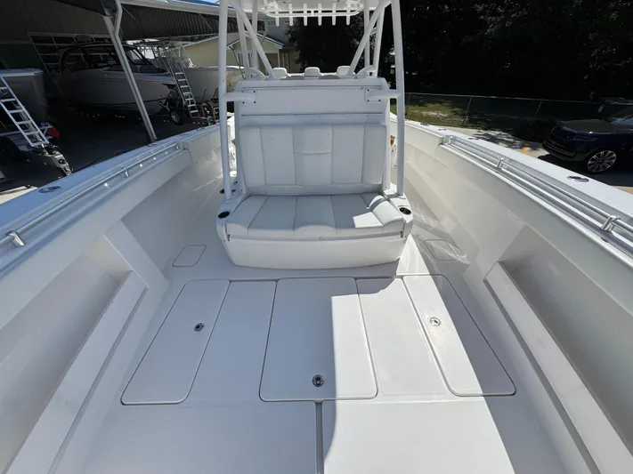  Yacht Photos Pics 2020 Invincible 39 Open Fisherman boat interior with white seating and storage compartments.