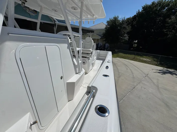  Yacht Photos Pics 2020 Invincible 39 Open Fisherman boat, sleek white deck, outdoor setting.