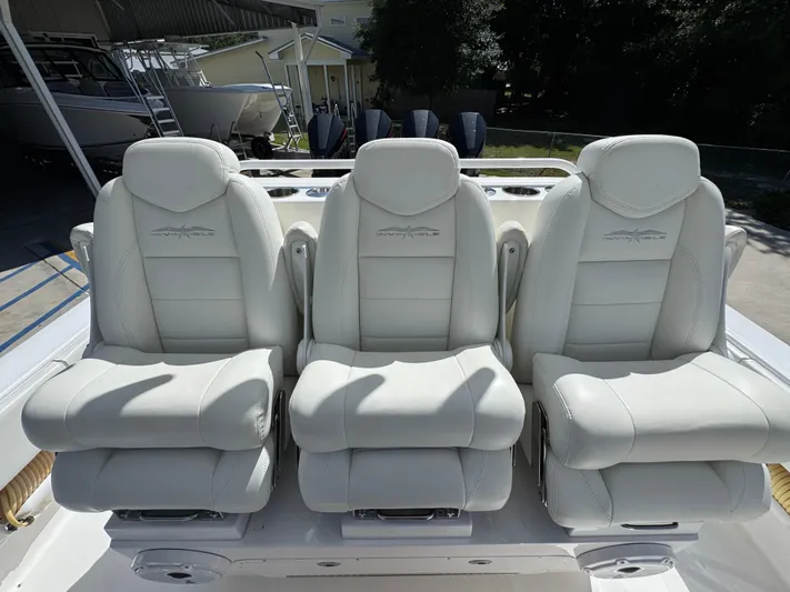  Yacht Photos Pics Three luxurious white seats on a 2020 Invincible 39 Open Fisherman boat.