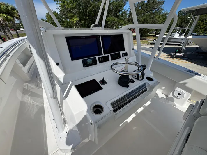  Yacht Photos Pics 2020 Invincible 39 Open Fisherman boat helm with dual screens and steering wheel.
