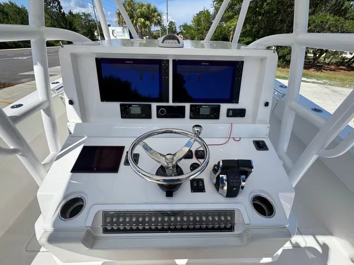  Yacht Photos Pics 2020 Invincible 39 Open Fisherman boat console with dual Simrad displays and steering wheel.