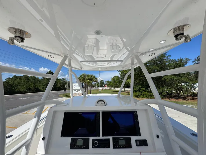 Yacht Photos Pics 2020 Invincible 39 Open Fisherman boat console with dual screens and overhead view.