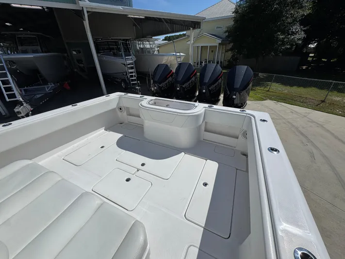  Yacht Photos Pics 2020 Invincible 39 Open Fisherman boat with multiple outboard engines in a marina.