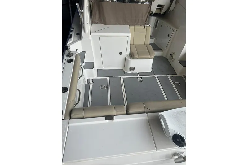  Yacht Photos Pics 2020 Pursuit OS 325 Offshore boat interior with seating and storage compartments.