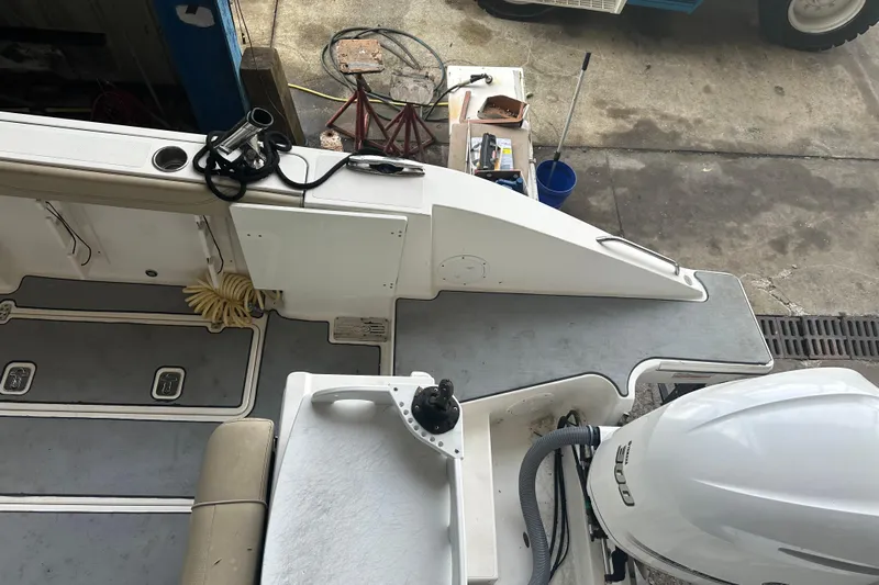  Yacht Photos Pics 2020 Pursuit OS 325 Offshore boat deck with equipment and outboard motor.