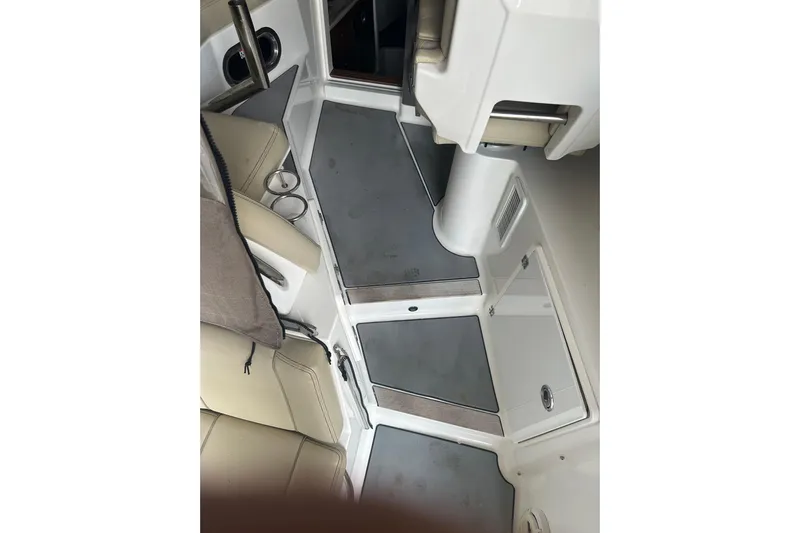  Yacht Photos Pics 2020 Pursuit OS 325 Offshore interior with beige seating and gray flooring.