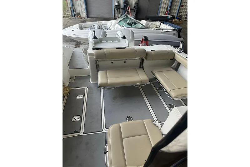  Yacht Photos Pics 2020 Pursuit OS 325 Offshore boat interior with beige seating and spacious deck.