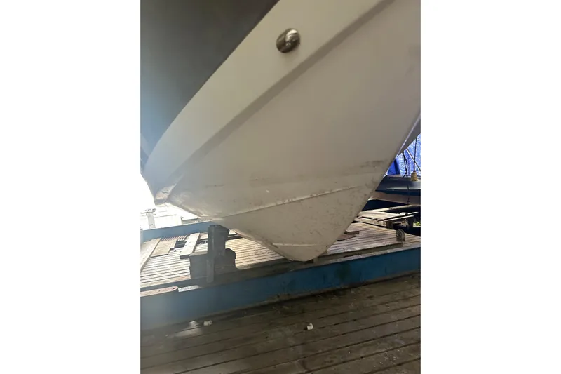  Yacht Photos Pics 2020 Pursuit OS 325 Offshore boat hull on a trailer.