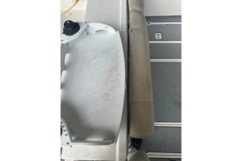  Yacht Photos Pics 2020 Pursuit OS 325 Offshore boat interior with seating and storage area.