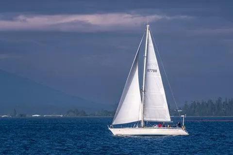 Name Reserved Yacht Photos Pics Sailing yacht Nautor Swan 46 (1985) on open sea under cloudy sky.