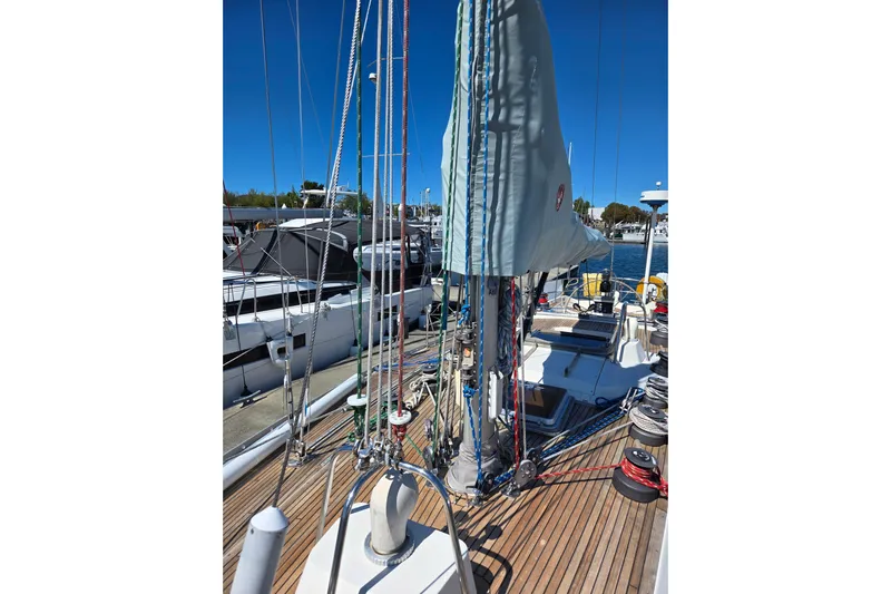 Name Reserved Yacht Photos Pics 1985 Nautor Swan 46 sailboat deck with rigging and marina view.