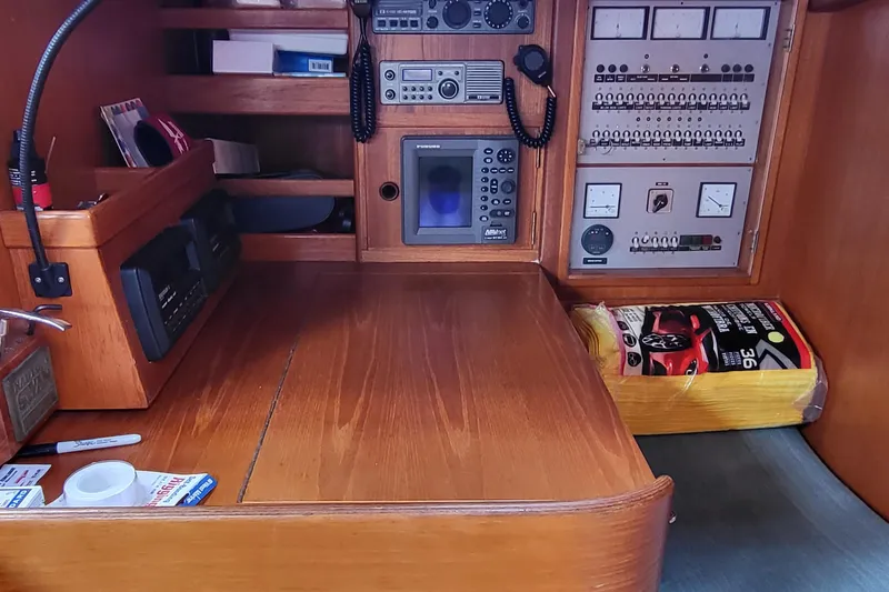 Name Reserved Yacht Photos Pics Navigation station of 1985 Swan 46 yacht with control panels and equipment.