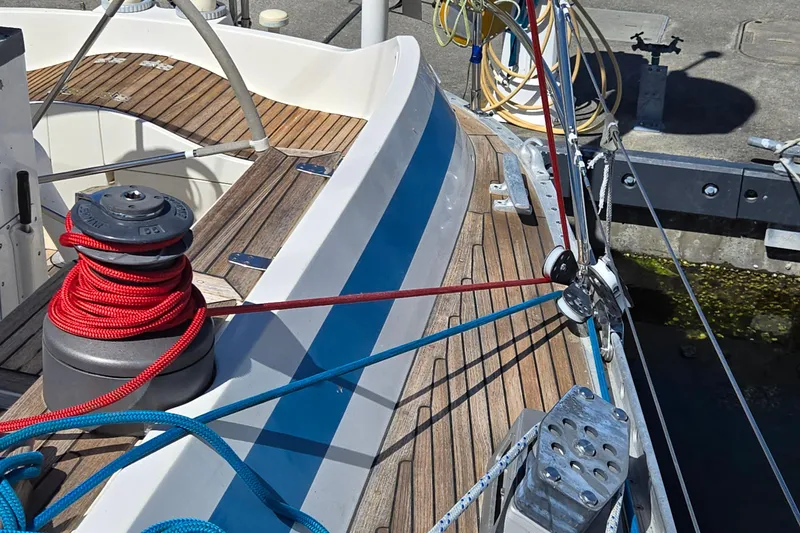 Name Reserved Yacht Photos Pics Deck of 1985 Swan 46 sailboat with ropes and winch in marina.