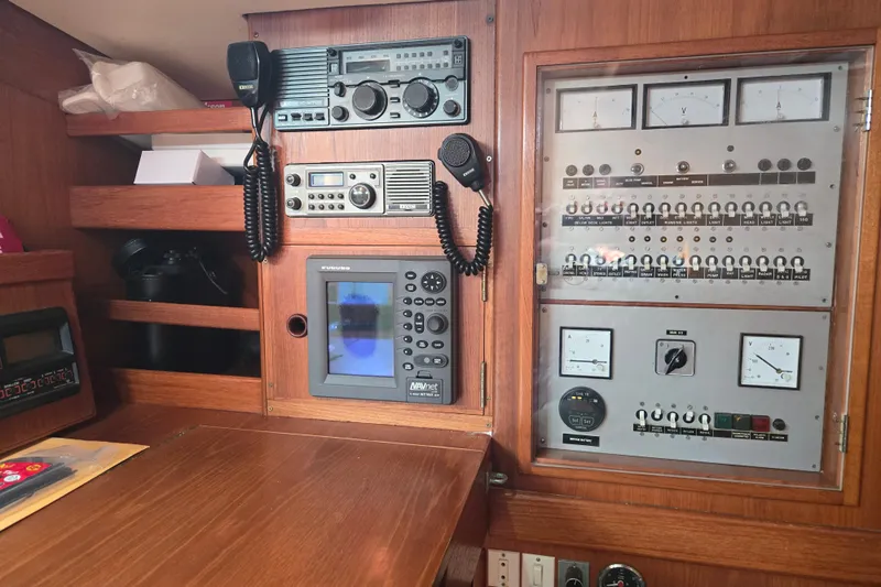 Name Reserved Yacht Photos Pics Control panel of a 1985 Swan 46 yacht with navigation and communication equipment.