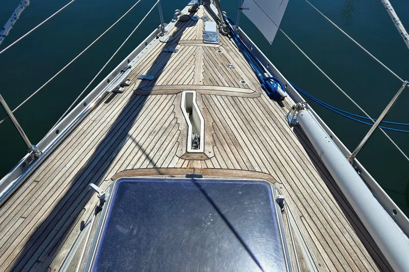 Name Reserved Yacht Photos Pics Deck of 1985 Swan 46 yacht with wooden finish and nautical equipment.