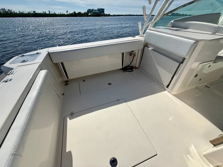  Yacht Photos Pics Cobia 330 Dual Console 2022, spacious deck by the water.