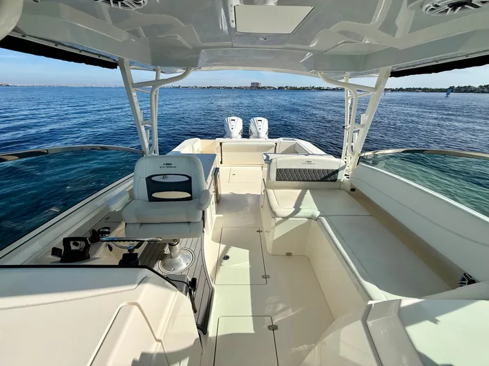  Yacht Photos Pics Interior view of 2022 Cobia 330 Dual Console boat on the water.