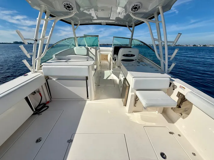  Yacht Photos Pics Interior view of a 2022 Cobia 330 Dual Console boat on the water.