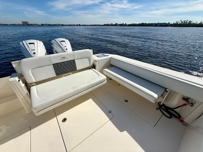  Yacht Photos Pics Cobia 330 Dual Console 2022 with twin outboard engines on calm water.