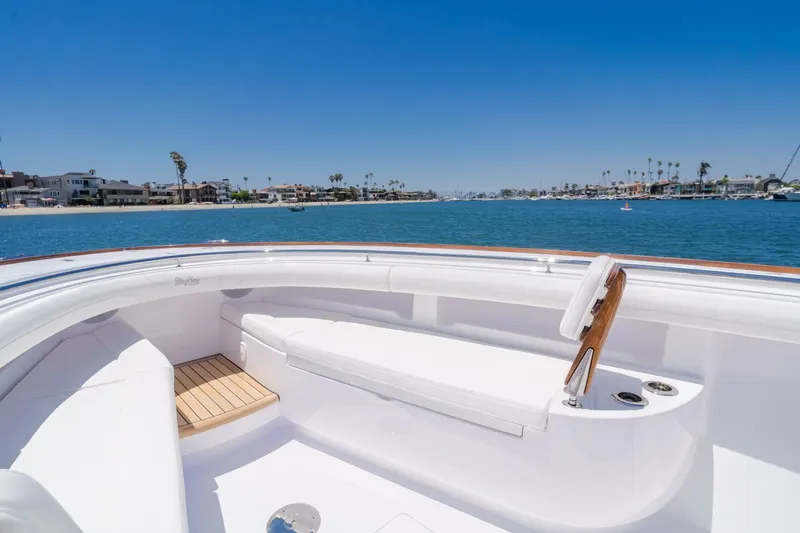  Yacht Photos Pics 2026 Mag Bay 43 Center Console boat with luxurious seating, cruising on a sunny day.