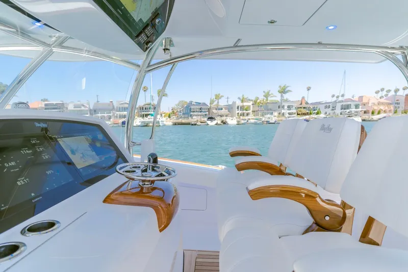  Yacht Photos Pics Interior view of 2026 Mag Bay 43 Center Console boat with luxurious seating and navigation displays.