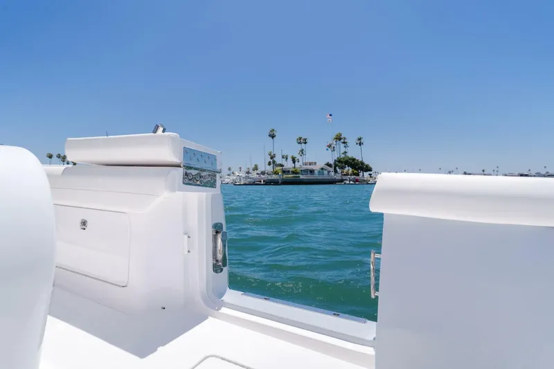  Yacht Photos Pics 2026 Mag Bay 43 Center Console on water, clear sky, coastal view.