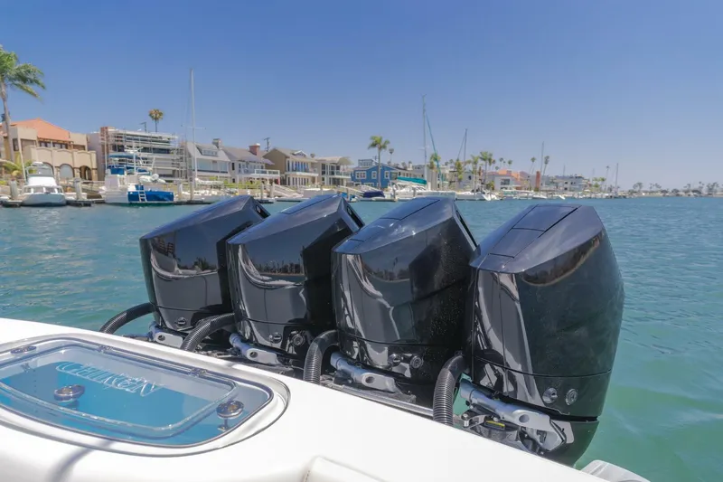  Yacht Photos Pics 2026 Mag Bay 43 Center Console with four powerful outboard engines docked in a marina.