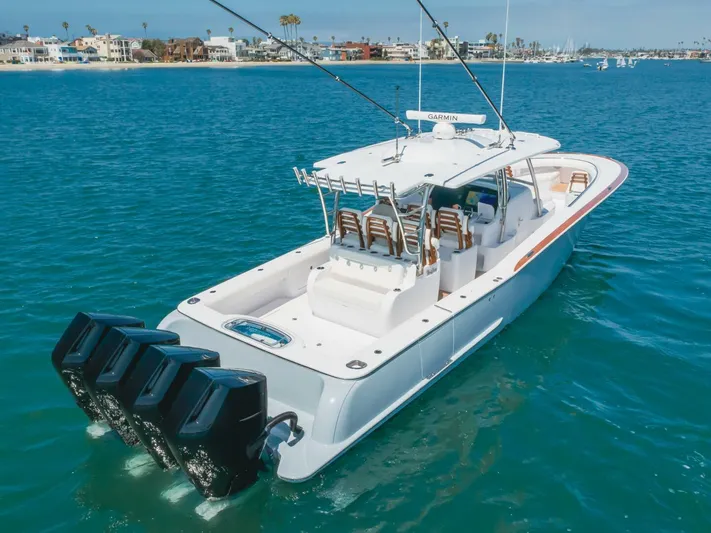  Yacht Photos Pics 2026 Mag Bay 43 Center Console boat on blue water, featuring multiple outboard engines.