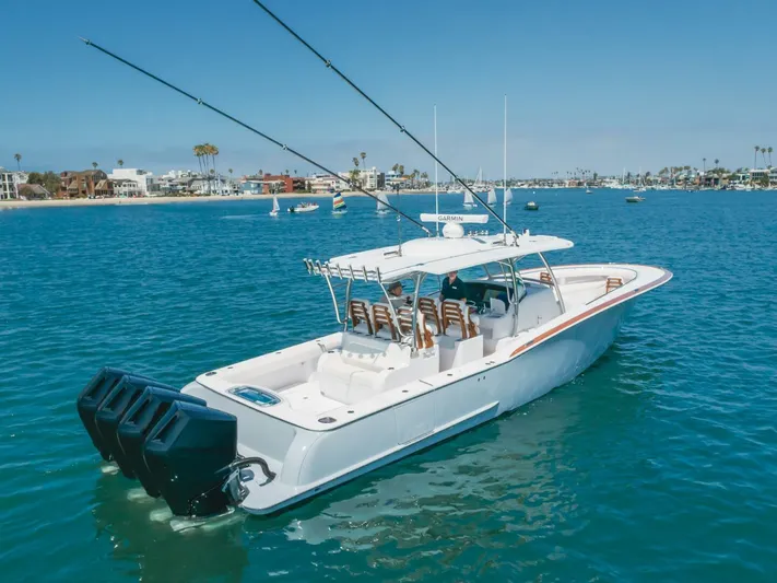  Yacht Photos Pics 2026 Mag Bay 43 Center Console boat cruising on clear blue water.