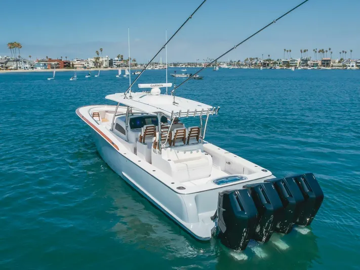  Yacht Photos Pics 2026 Mag Bay 43 Center Console boat on clear blue water, featuring multiple outboard engines.
