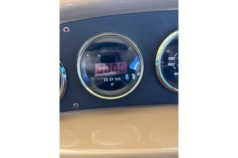 Mr & Mrs Smith Yacht Photos Pics Close-up of 2003 Carver 450 Voyager Pilothouse RPM gauge at zero.