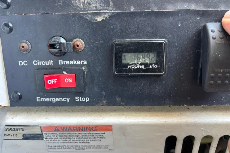 Mr & Mrs Smith Yacht Photos Pics Control panel of a 2003 Carver 450 Voyager Pilothouse with circuit breakers and hour meter.