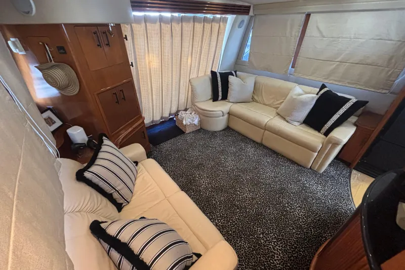 Mr & Mrs Smith Yacht Photos Pics Luxurious interior of 2003 Carver 450 Voyager Pilothouse with plush seating and elegant decor.