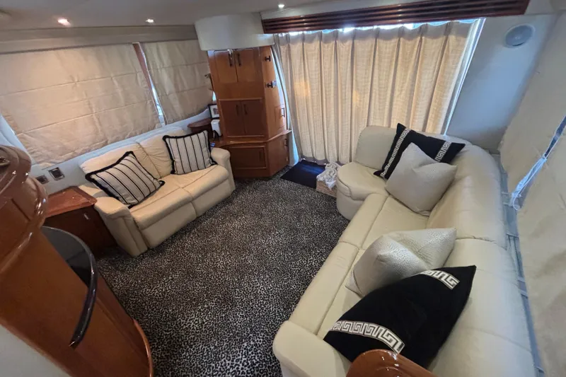 Mr & Mrs Smith Yacht Photos Pics Luxurious interior of 2003 Carver 450 Voyager Pilothouse with plush seating and elegant decor.